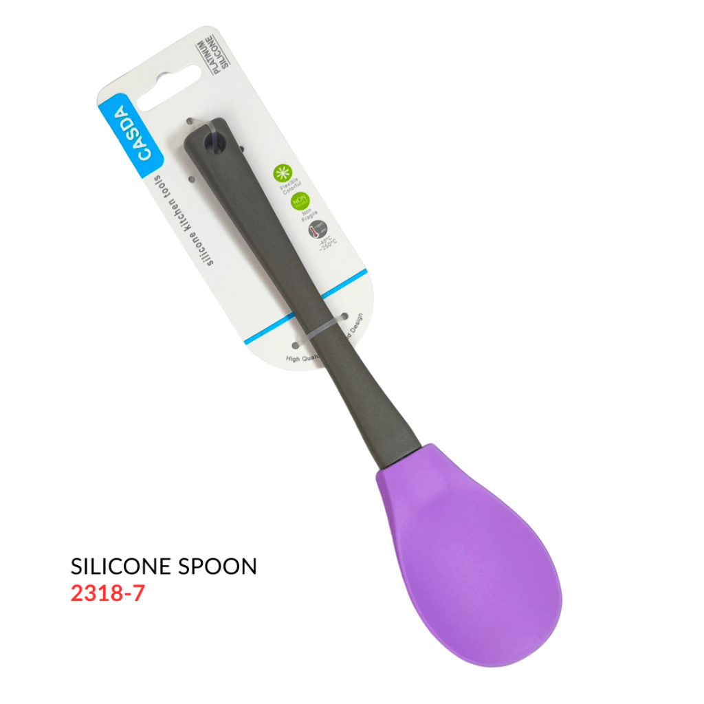 A purple silicone spoon with a black handle, packaged for retail display.