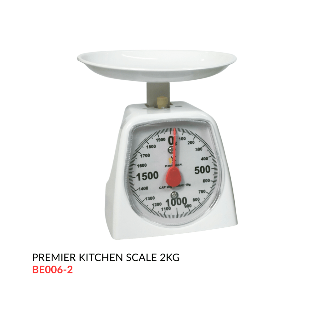 A white Premier kitchen scale with a circular dial and a flat weighing platform, capable of measuring up to 2kg.