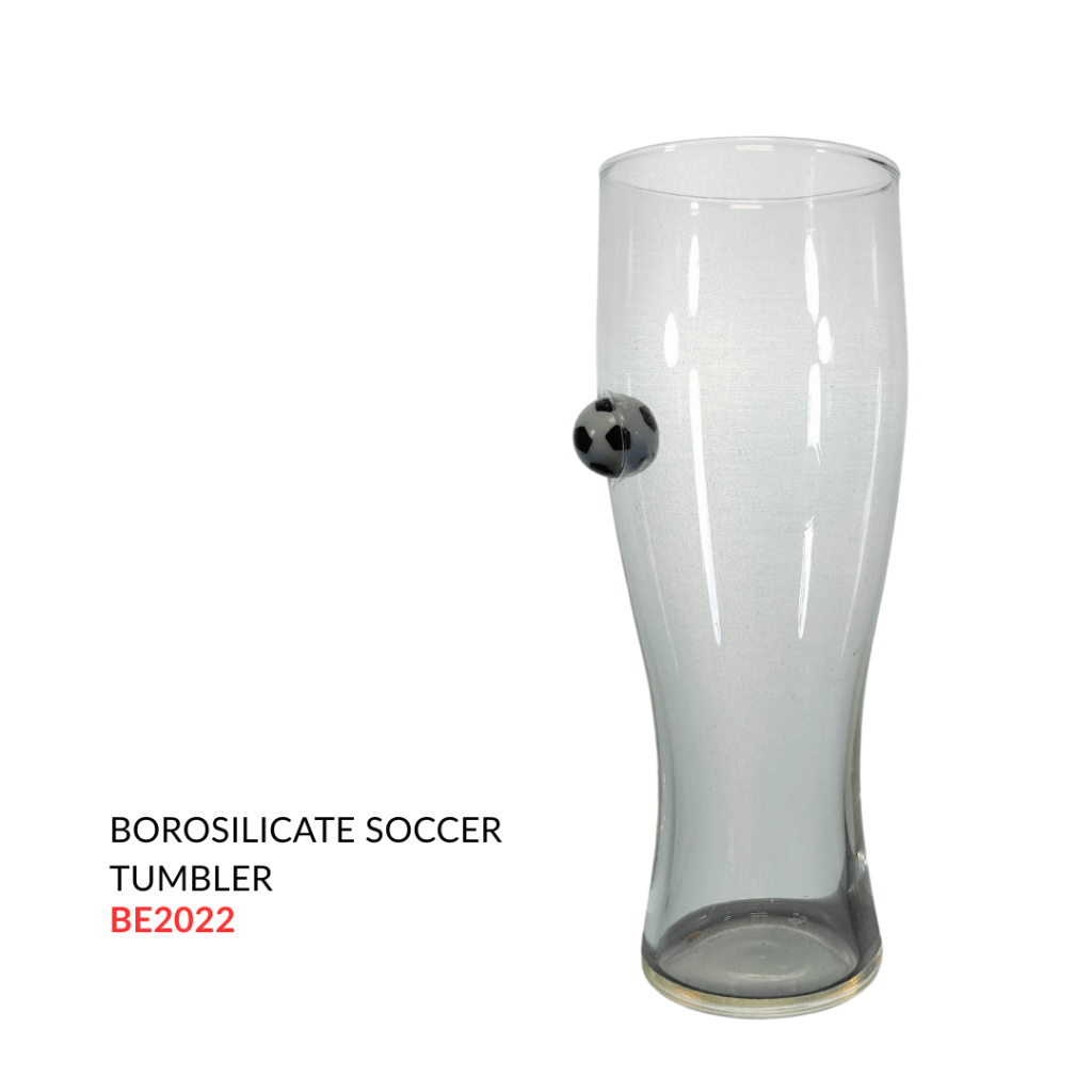 Borosilicate glass soccer tumbler featuring a soccer ball design on the side.