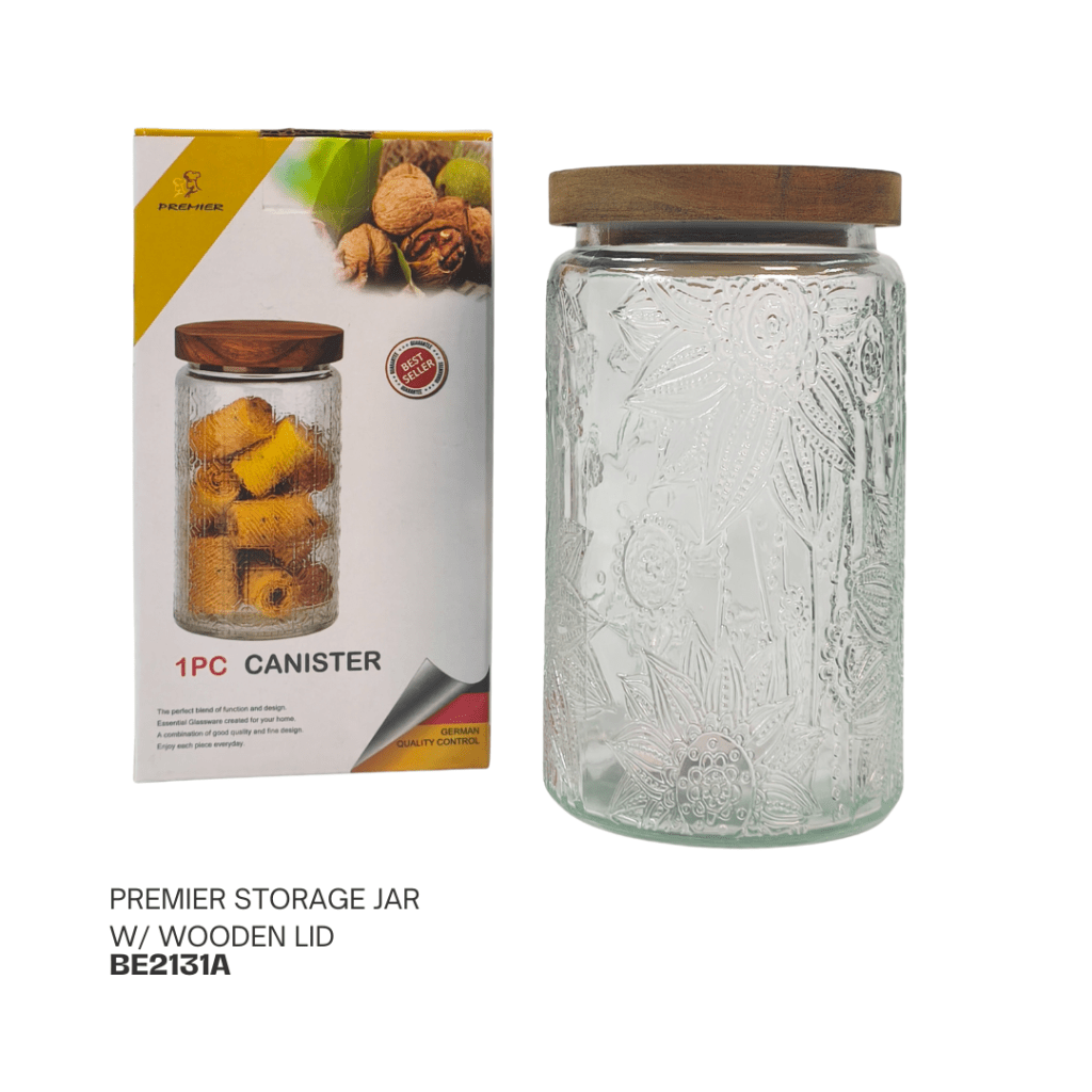 Glass storage jar with a wooden lid, featuring floral designs, displayed next to its packaging.