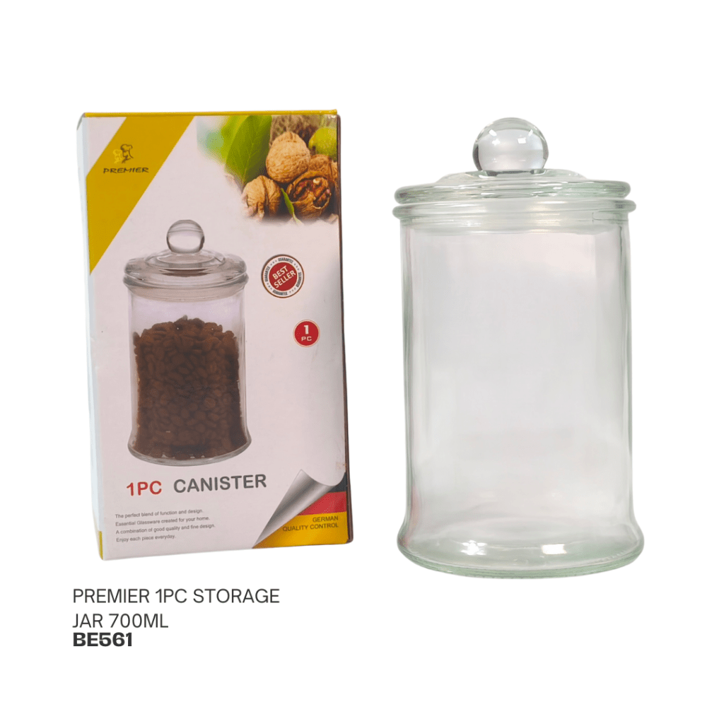 A glass storage canister with a lid, 700ml capacity, displayed next to its packaging featuring images of nuts and product information.