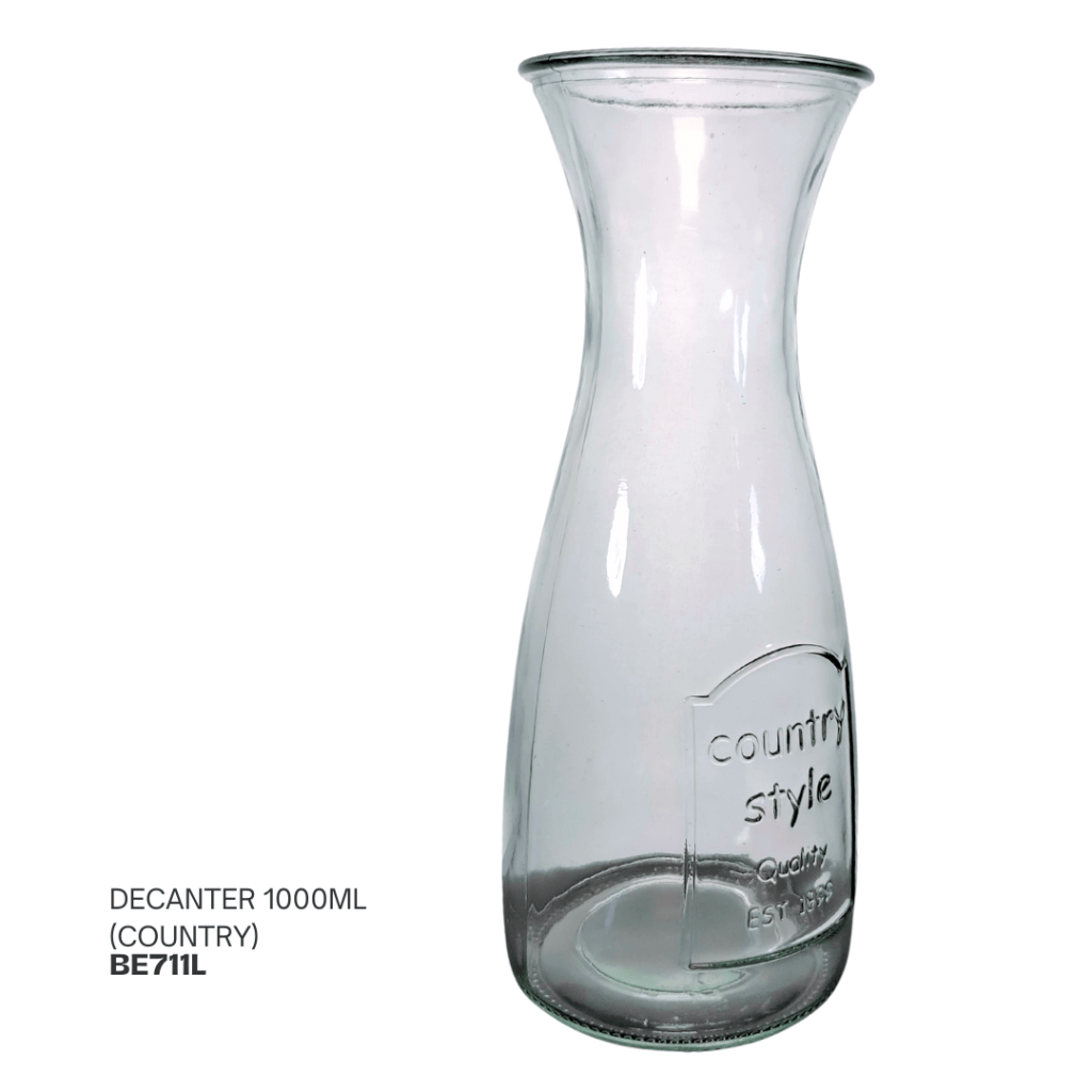 A clear glass decanter with a tapered design, holding 1000ml, featuring an embossed label that reads 'country style Quality EST 1995'.