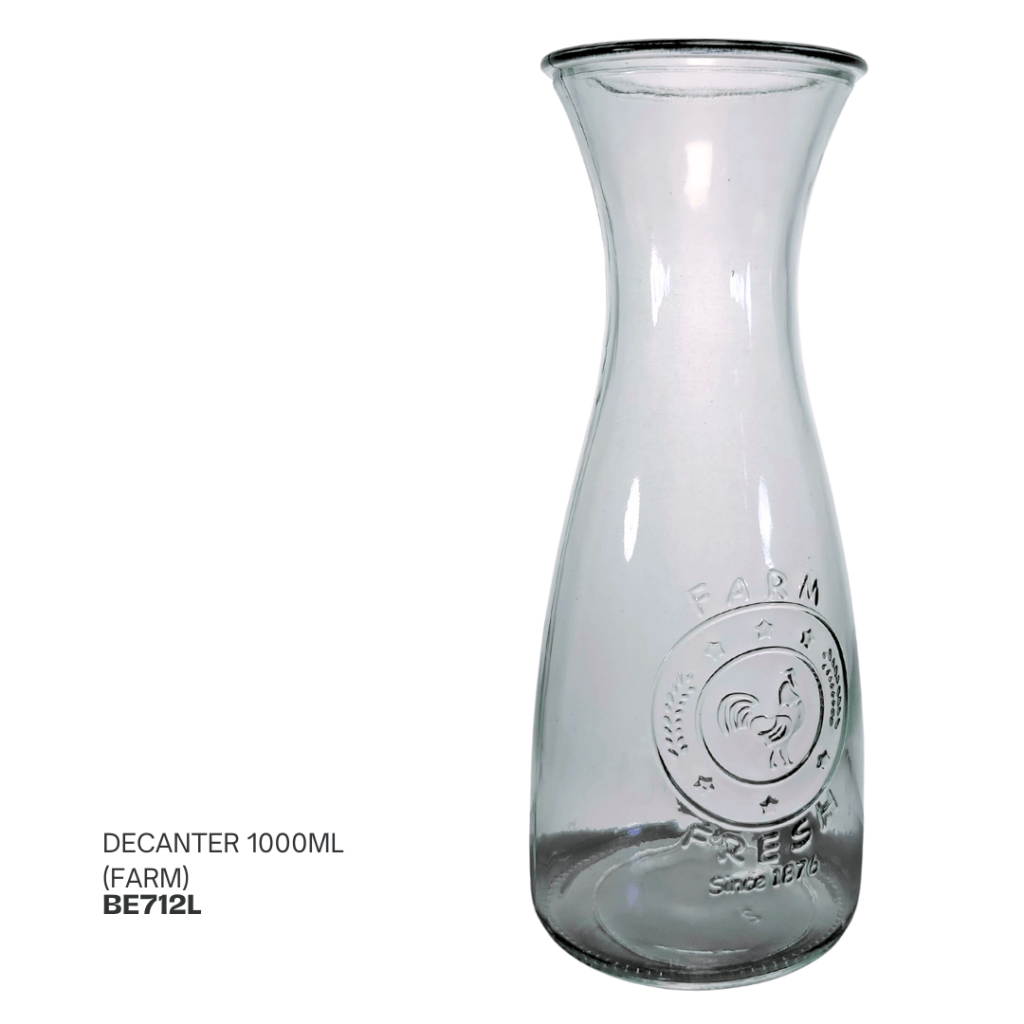 Clear glass decanter with a narrow neck and embossed design, labeled 'FARM FRESH' and featuring a rooster emblem.