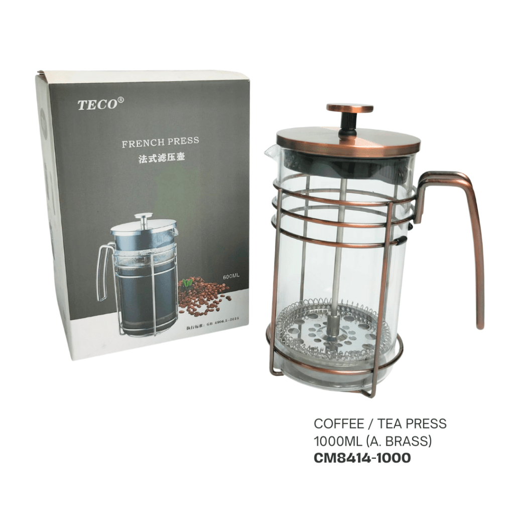 A French press coffee and tea maker with a 1000ml capacity, featuring a glass body and brass accents, displayed alongside its packaging.