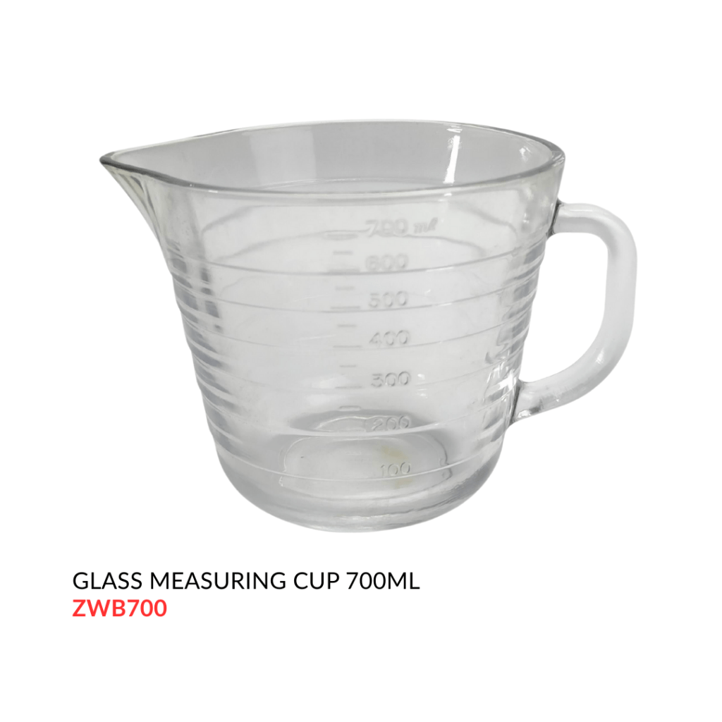 Clear glass measuring cup with a handle, marked with measurement indicators up to 700ml.